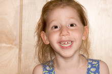Smiling Girl Showing Her Fallen Off Snaggle Teeth