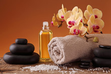 Spa Still Life With Hot Stones, Essential Oil And Orchid