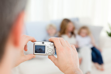 Wall Mural - Man taking a photo of his family