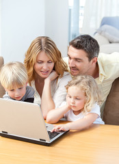 Family looking at their laptop