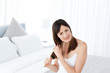© WavebreakMediaMicro - Beautiful woman brushing her hair