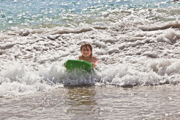 boy has fun with the surfboard