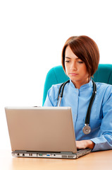 Young female doctor working at the computer