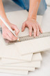 © CandyBox Images - Home improvement - handywoman measuring tile