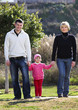 © Kalim - Family walk in the park
