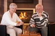© nyul - Portrait of elderly couple playing chess