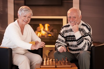 Poster - Portrait of elderly couple playing chess