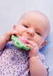 baby eating toy