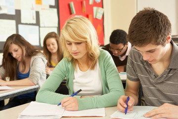 Teenage Students Studying In Classroom