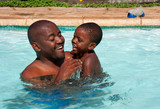 Fototapeta Dmuchawce - african father son swim