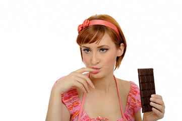 beautiful woman eating chocolate bar. isolated on white backgrou