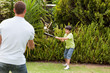 © WavebreakMediaMicro - Happy father and his son playing baseball