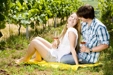 Wall Mural - couple at a picnic in vineyard