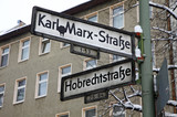Fototapeta  - Direction signs on a post in Berlin, Germany