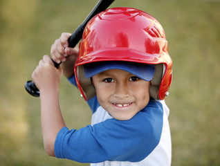 Portrait of Boy with Baseball Bat and Red Helmet