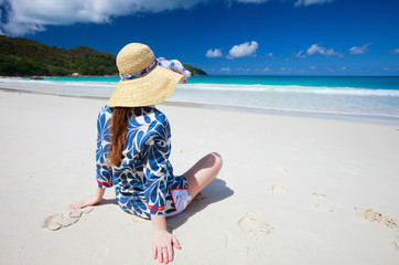 Wall Mural - Young woman relaxing at beach