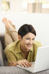 Wall Mural - Happy woman browsing internet