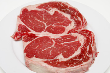 Wall Mural - Prime Ribeye Steaks on a White Plate