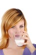 beautiful blond woman with a glass of milk (white background)