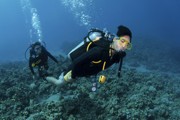  Asian scuba divers having fun