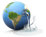 Fototapeta  - Earth globe with water tap dropping water