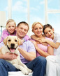 © pressmaster - Family with dog