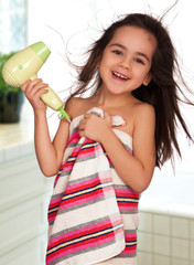little girl with hairdryer