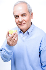 Wall Mural - Man eating orange