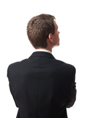 back of pensive young businessman looking up isolated