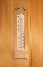 Thermometer On Wooden Wall In Sauna.