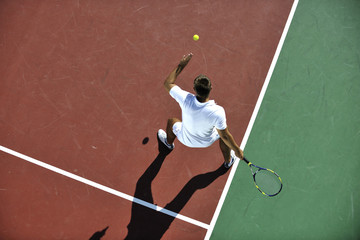 young man play tennis