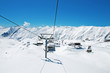 © Elnur - Ski lift chairs on bright winter day