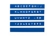 Embossed alphabet on blue plastic tape