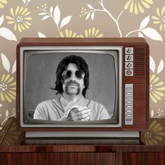 geek mustache tv presenter in retro wood television