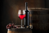 Fototapeta  - red wine on old barrel