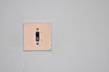 The old electric switch on a wall