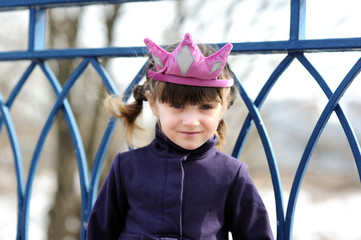 Wall Mural - Adorable little princess in pink tiara and purple coat