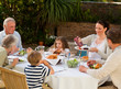 © WavebreakMediaMicro - Adorable family eating in the garden