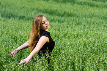 Happy young woman in a field