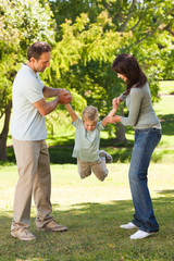 Canvas Print - Joyful family in the park