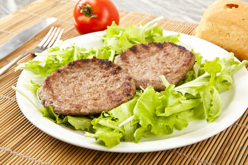 two hamburger on green lettuce