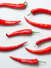 Red Chilies On White Background