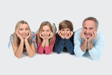 Happy family laying down the floor