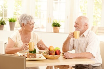 Canvas Print - Happy elderly couple having breakfast