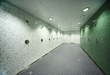 © Pavel Losevsky - big, light, empty public shower room, green tile on walls