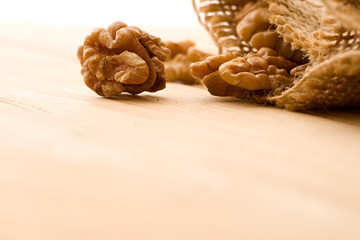 Wall Mural - Walnut isolated on wooden background