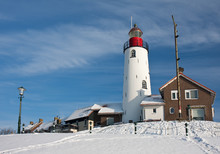 Dutch Lighthouse Of Fishery Village Urk In Wintertime