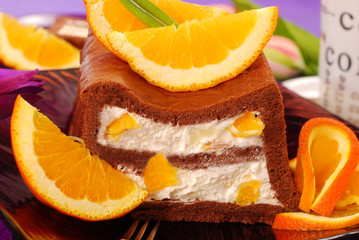 Wall Mural - chocolate cake with cream and oranges