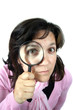 © jpcasais - Young businesswoman holding Magnifying Glass, business photo