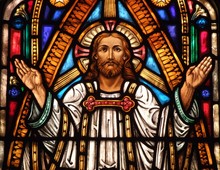 Stained Glass Window Of Jesus With His Hands Up